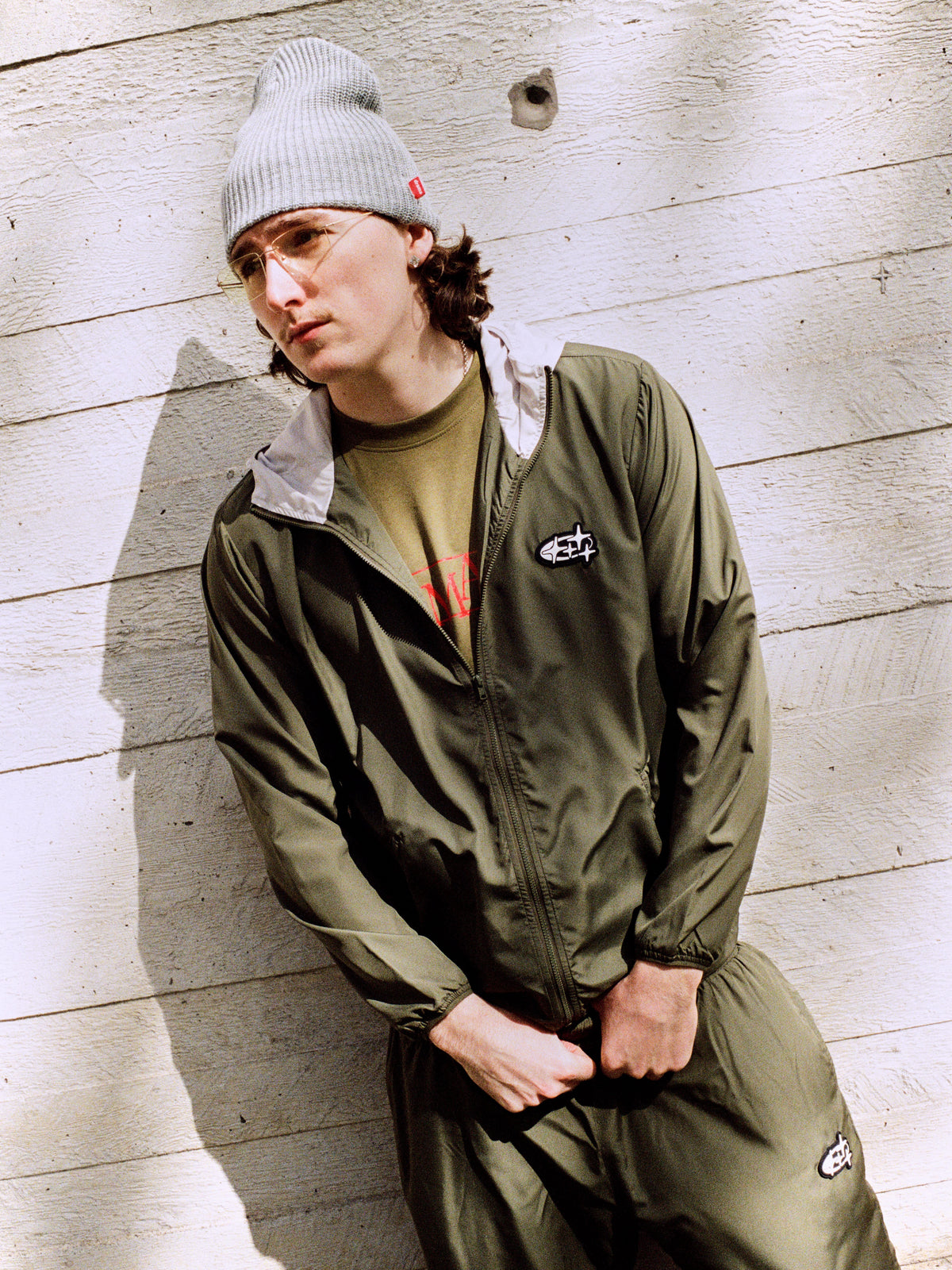 Model wearing army green Drama Call 4sta running shorts