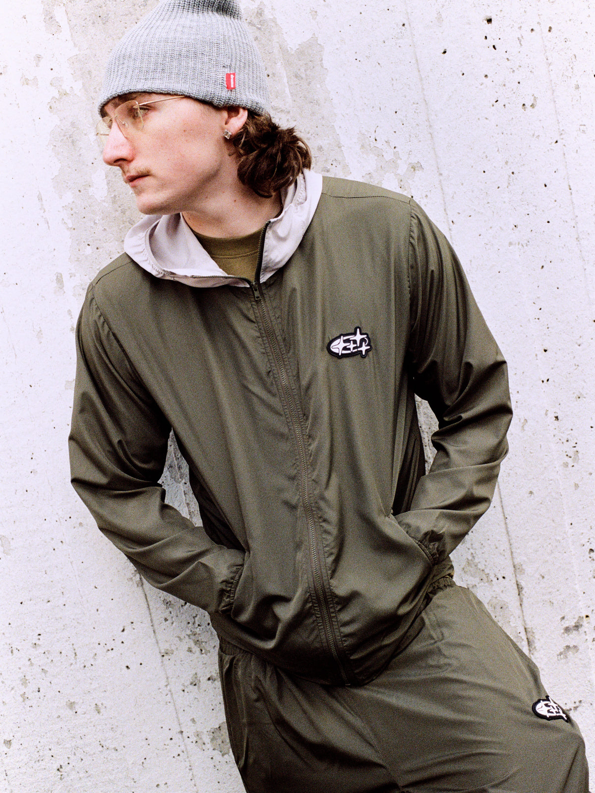 Model wearing army green Drama Call 4STA running shorts