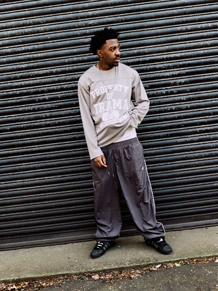 Model wearing ash grey Drama Call STA baggy nylon shorts