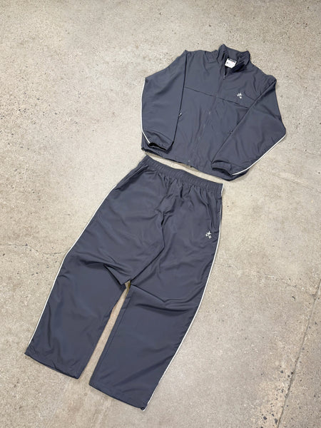 Men's ash grey Drama Call STA baggy nylon tracksuit set, flat lay front view.
