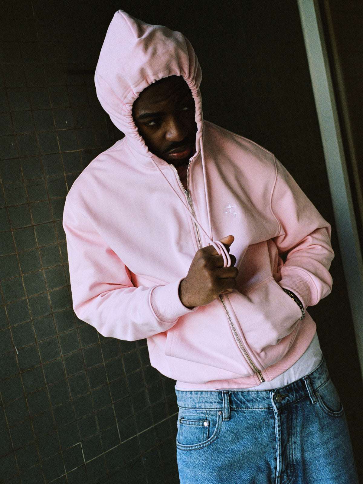 Model wearing light pink drama zip hoodie - streetwear look