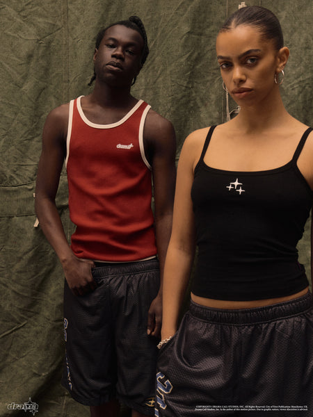 Model wearing black Drama Call 1998 mesh shorts