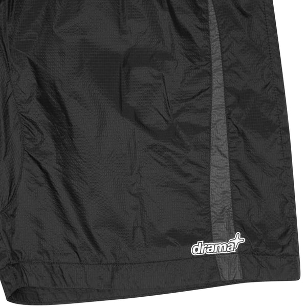Close-up detail of black Drama Call ripstop shorts