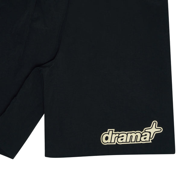 Close-up detail of black Drama Call 1STA swim shorts