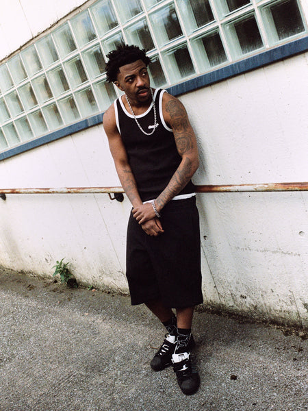 Model wearing black Drama Call 3STA hole shorts