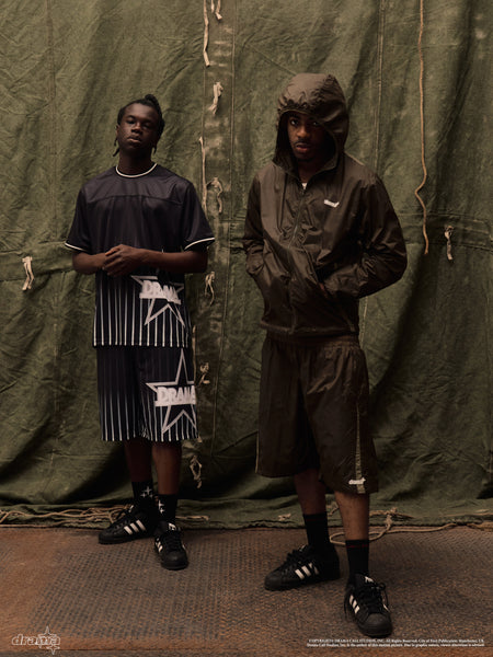 Two models wearing Drama Call black all star mens shorts and matching outfits