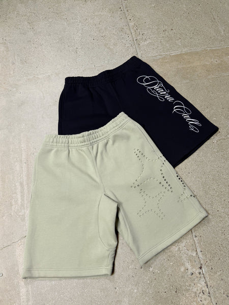 Men's black and army green Drama Call shorts flat lay view