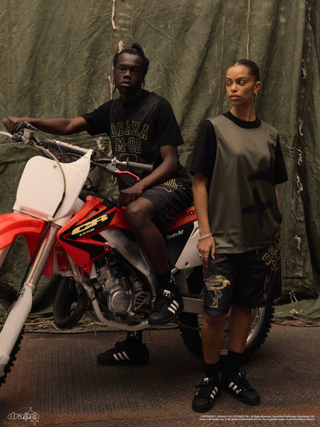 Men's black animal mesh shorts in a lifestyle photoshoot 