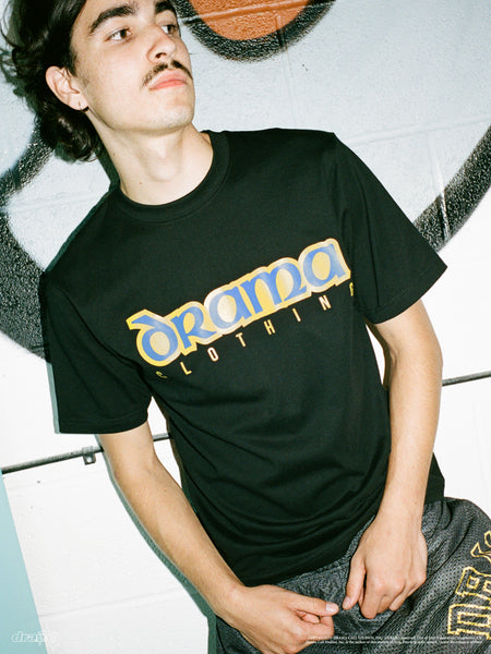 Model wearing the black Drama Call Celt graphic tee