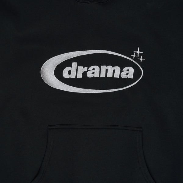 Close-up detail of the black Drama Call oval logo