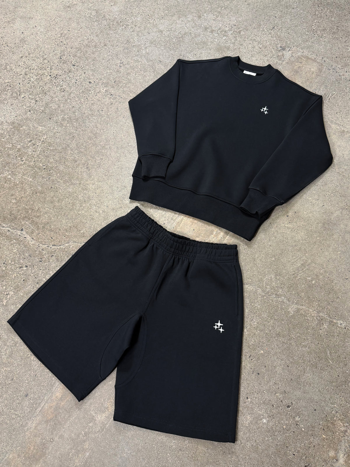 Men's black Drama Call STA crewneck sweatshirt set, flat lay view.
