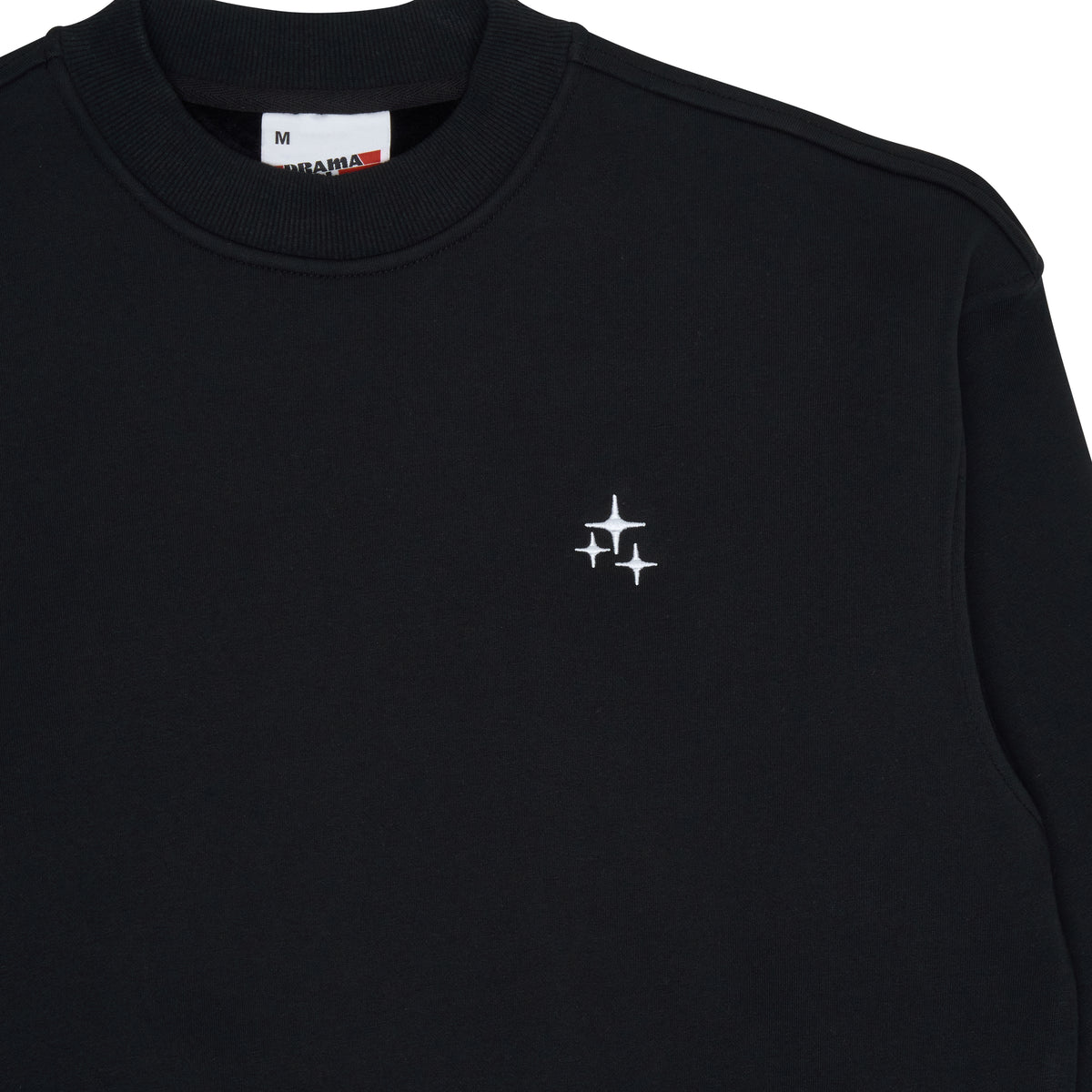 Close-up of the black Drama Call STA crewneck