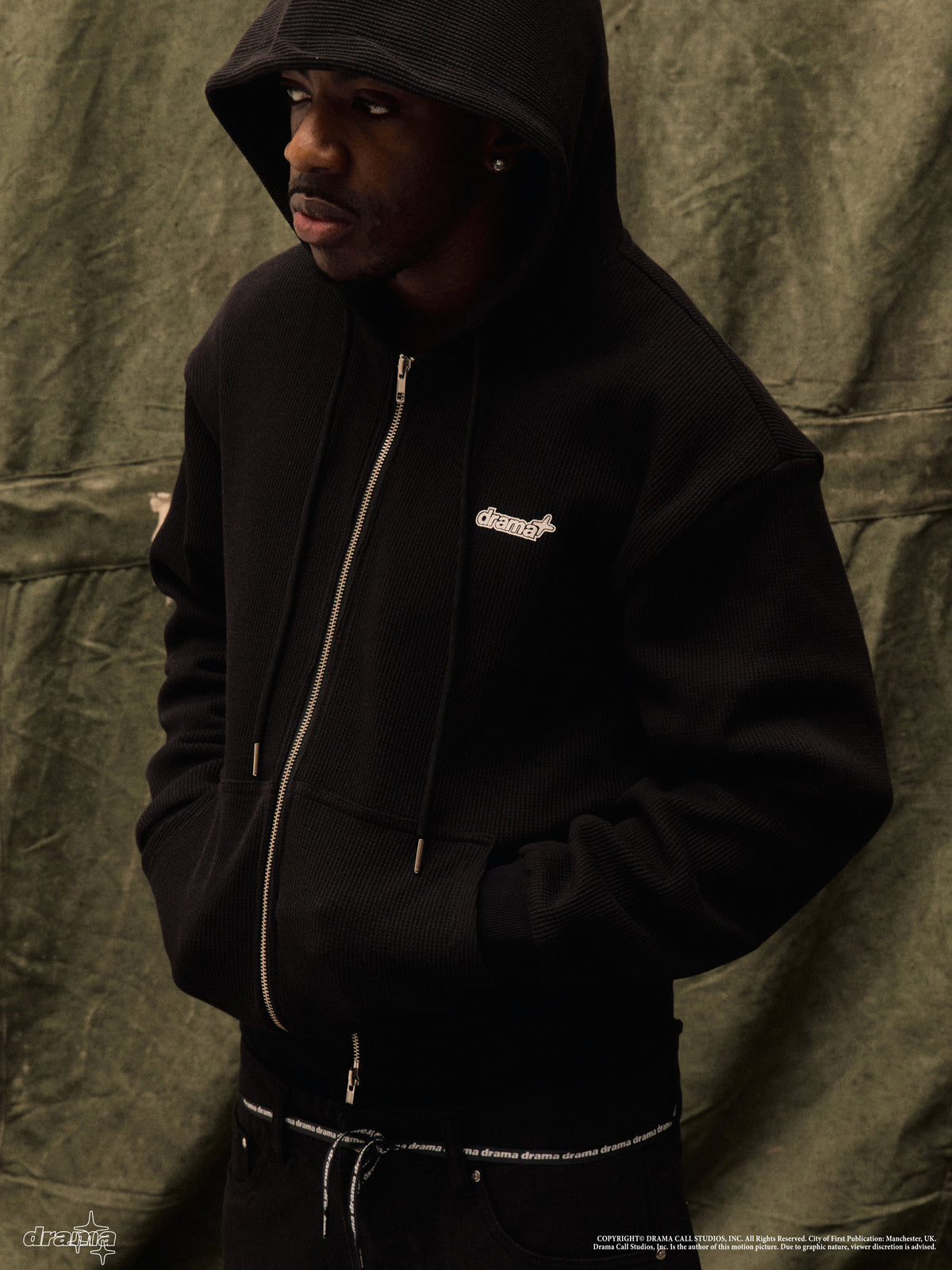 Men's black waffle zip-up hoodie worn by a model