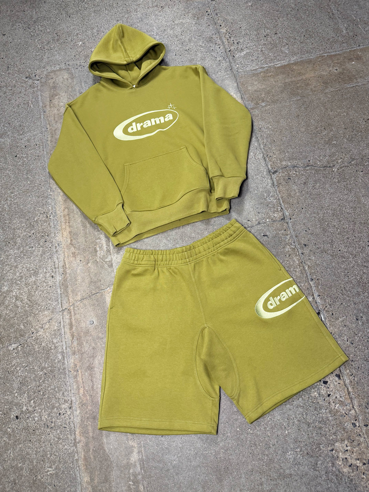Green Drama Call oval hoodie set flat lay view.
