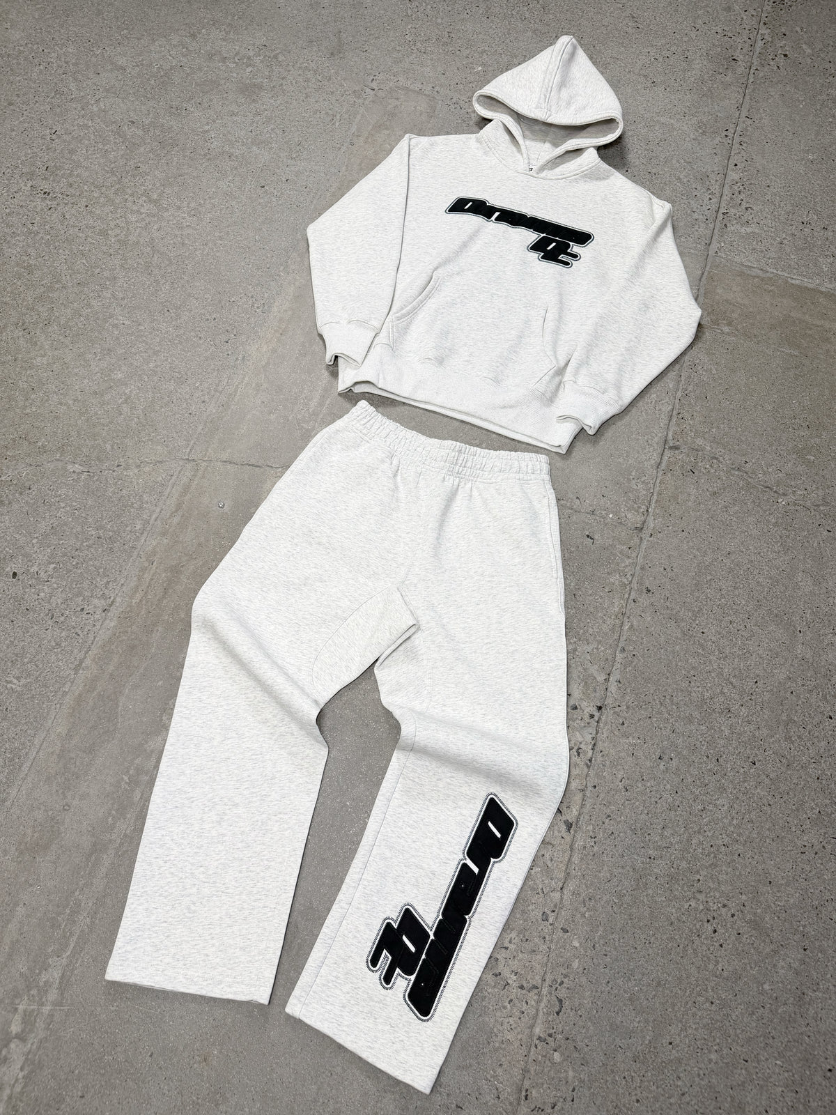 Grey Drama Call AV Sport hoodie and matching trackpants laid out flat