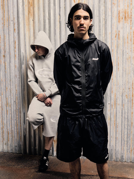 Model wearing the grey Drama Call OG oval hoodie