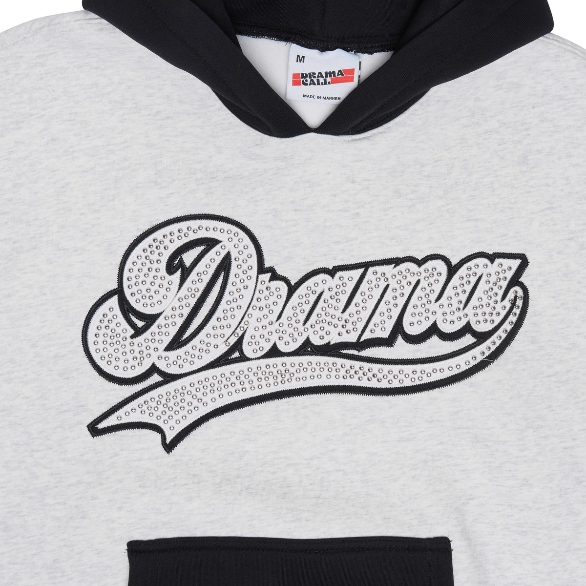 Close up view of the grey Drama Call stud script vest hoodie