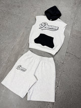 Men's grey Drama Call stud script vest hoodie set in a flat lay view.