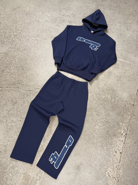 Men's navy AV sport hoodie and matching sweatpants set laid out flat
