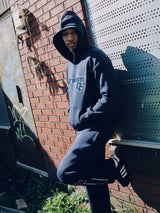 Model wearing the navy Drama Call AV Sport mens hoodie