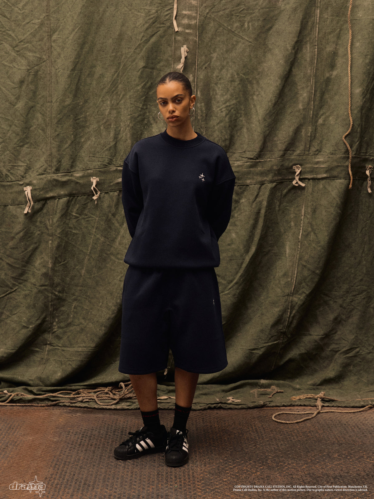Model wearing a navy Drama Call STA crewneck 