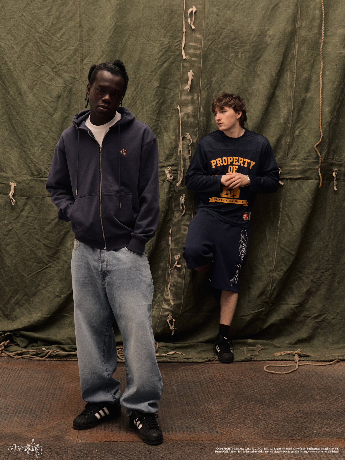 Two male models showcasing the navy Drama Call STA zip-up hoodie